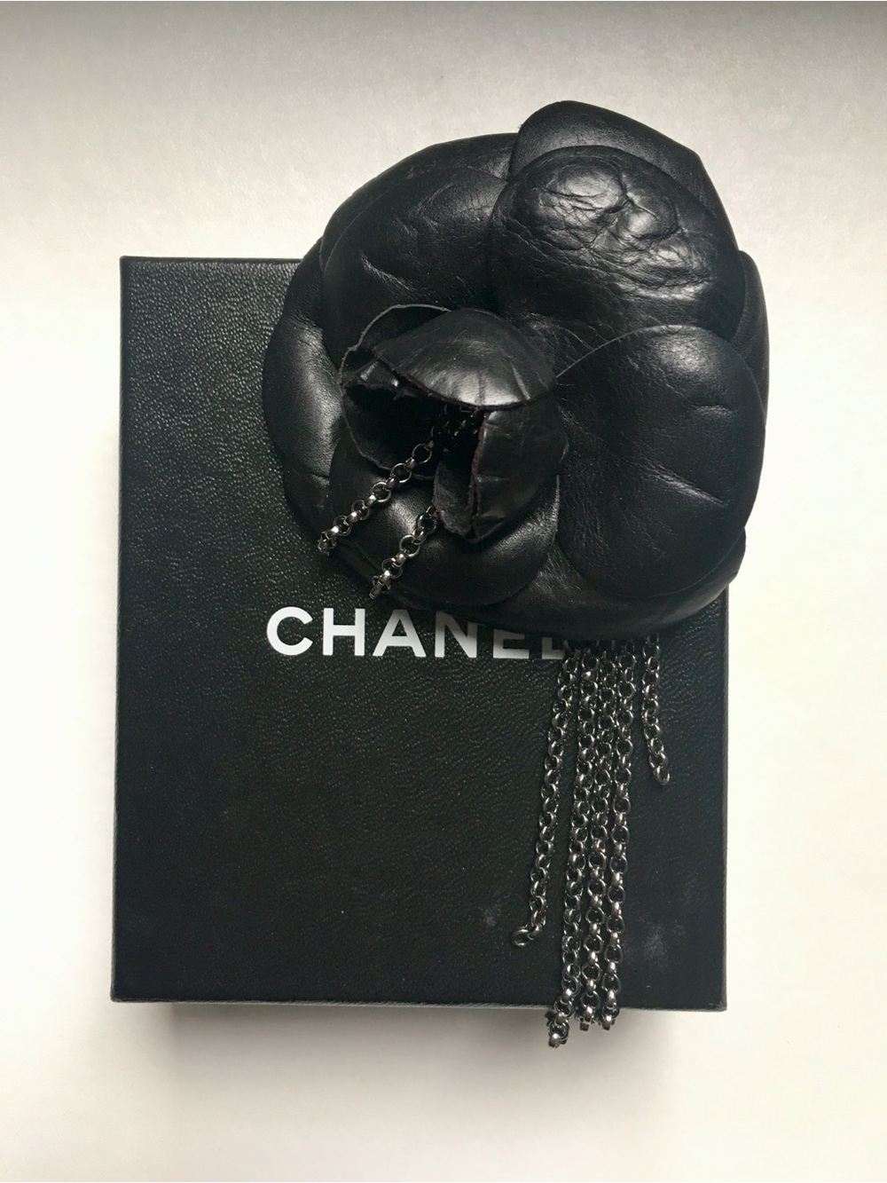 CHANEL Black Leather Camellia Brooch with Gunmetal Chain Tassels